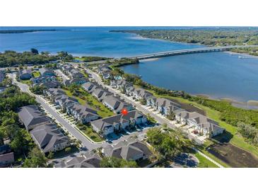 Beautiful aerial view of waterfront townhomes with stunning water and bridge views at 1010 Mango Ct, Oldsmar, FL 34677