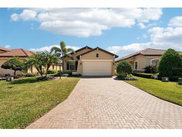 Charming single-story home with a well-manicured lawn and beautiful landscaping at 10612 Glencorse Ter, Bradenton, FL 34211