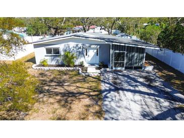 Charming single-story home featuring a freshly painted exterior and well-maintained landscaping at 813 Helena Dr, Largo, FL 33770