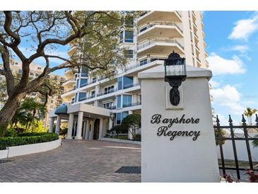 Bayshore Regency entrance with well-manicured landscaping and elegant architecture showcasing a luxurious, welcoming facade at 3435 Bayshore Blvd # 1401S, Tampa, FL 33629