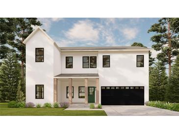 Modern two-story home featuring a black garage door, minimalist windows, and stylish architecture at 1405 50Th N Ave, St Petersburg, FL 33703