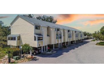 Coastal townhome with beachy vibe and front carports, near area attractions at 1500 Sunset Rd # G4, Tarpon Springs, FL 34689