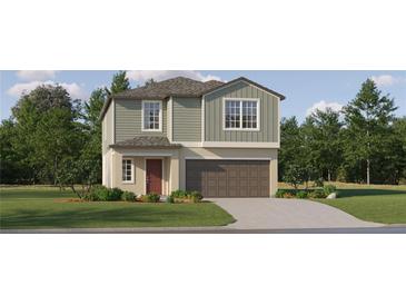 Charming two-story home with a well-manicured lawn and attached two car garage at 17560 Happytrails St, Land O Lakes, FL 34638