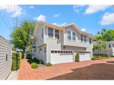 Stunning townhome boasts a private two-car garage and a beautifully landscaped exterior at 2920 W El Prado Blvd # 4, Tampa, FL 33629