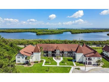 Beautiful building with meticulously maintained landscaping and partial water view at 320 N Bayshore Blvd # 208, Clearwater, FL 33759