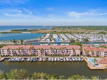 Enjoy waterfront living with beautiful condo community and boat docks, near a large body of water at 5000 Culbreath Key Way # 8-308, Tampa, FL 33611