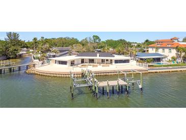 Waterfront home featuring a private dock and boat lift offering convenient access to the open water at 2970 68Th S Ave, St Petersburg, FL 33712