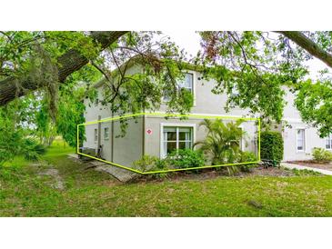 Inviting two-story condo with manicured landscaping and verdant tree coverage at 367 Bobby Jones Rd # 367, Sarasota, FL 34232