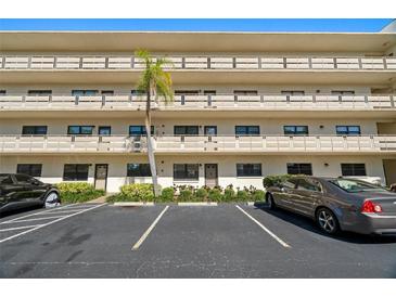 Charming condo building featuring multiple floors and a well-manicured landscape with parking at 6070 80Th N St # 104, St Petersburg, FL 33709