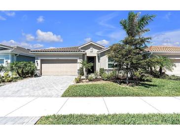Charming one-story home with a two-car garage and well-maintained landscaping at 20647 Ovid Ln, Venice, FL 34293
