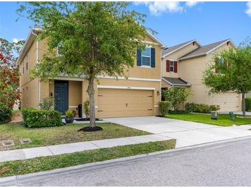 Inviting two-story home with a well-manicured lawn and a two-car garage, perfect for Gathering living at 5946 81St N Ave, Pinellas Park, FL 33781