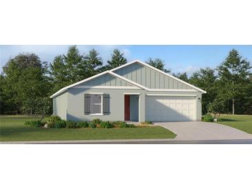 Charming single-story home featuring a two-car garage, well-maintained lawn, and pleasing exterior color scheme at 5618 Red Kite Dr, Wimauma, FL 33598