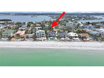 Stunning beachfront homes with sparkling pools, offering a luxurious coastal living experience at 101 Gulf Blvd, Belleair Beach, FL 33786