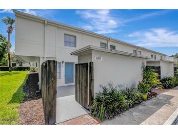 Charming townhome featuring a private entrance and well-maintained landscaping at 4201 La Palma Ct, Tampa, FL 33611