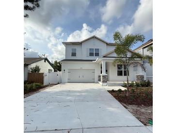 Charming two-story home featuring a classic white exterior and a welcoming two-car garage at 5011 21St N Ave, St Petersburg, FL 33710