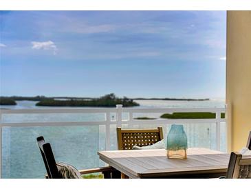 Balcony overlooking the waterfront features seating and a beautiful view at 755 Collany Rd # 504, Tierra Verde, FL 33715