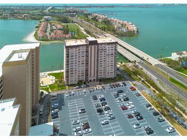 Striking aerial view highlighting condo with parking, serene waterfront views, and easy bridge access at 5220 Brittany S Dr # 210, St Petersburg, FL 33715