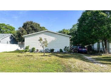 Charming single-story home featuring a spacious yard and a convenient driveway for easy parking at 6051 106Th N Ave, Pinellas Park, FL 33782