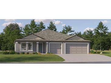 Charming single-story home featuring a two-car garage, landscaped yard, and covered entry at 11864 Blue Diamond Trl, Parrish, FL 34219
