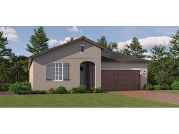 Charming single-story home with a two-car garage, neutral stucco exterior and well-maintained landscaping at 31719 Griffin Sands Ln, San Antonio, FL 33576