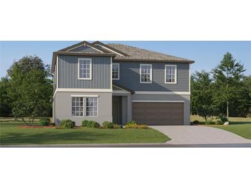 Two story home with grey siding, attached two car garage, landscaped yard and concrete driveway at 8536 Bella Mar Trl, Parrish, FL 34219