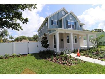 Charming two-story home with a covered porch and landscaped front yard at 5235 9Th N Ave, St Petersburg, FL 33710