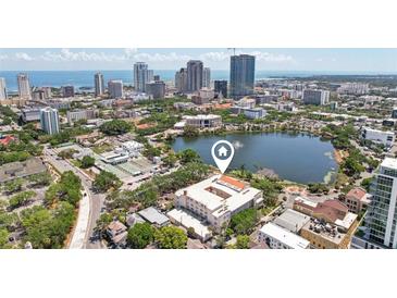 An aerial view of a condominium complex in St. Petersburg, Florida, overlooking Mirror Lake and downtown at 701 Mirror Lake N Dr # 119, St Petersburg, FL 33701