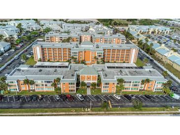 Aerial view showcasing this beautiful condo community with lush landscaping and ample parking at 1900 68Th N St # 110, St Petersburg, FL 33710