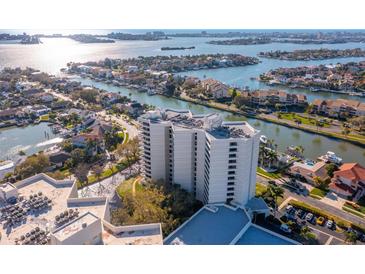 Stunning aerial view of a high-rise condo complex nestled along the waterfront, showcasing its prime location and beautiful surroundings at 5950 Pelican Bay S Plz # 603, Gulfport, FL 33707