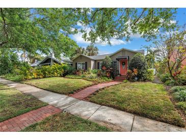 Charming single-story home with a beautifully landscaped front yard and brick walkway at 138 17Th N Ave, St Petersburg, FL 33704