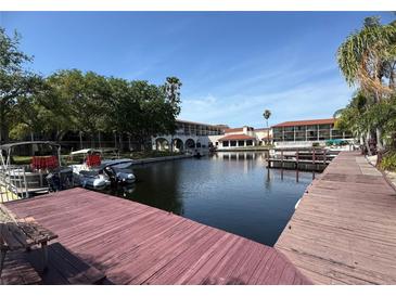 Beautiful waterfront view with docks and boats in a serene and picturesque community setting at 2571 Cyprus Dr # 1-102, Palm Harbor, FL 34684