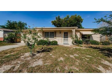 Charming single-story home with a well-maintained front yard and covered entry, blending comfort and curb appeal at 3815 Bowen St, New Port Richey, FL 34652
