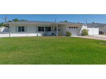 Charming single-story home with a well-maintained lawn and lovely curb appeal on a sunny day at 731 44Th Ne Ave, St Petersburg, FL 33703