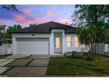 Charming single-Gathering home with modern design, well-manicured lawn, and inviting curb appeal at 3422 E Powhatan Ave, Tampa, FL 33610