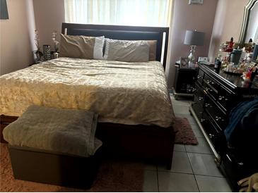 Comfortable bedroom with a large bed, soft lighting, and stylish furnishings at 1312 Foxboro Dr., Brandon, FL 33511