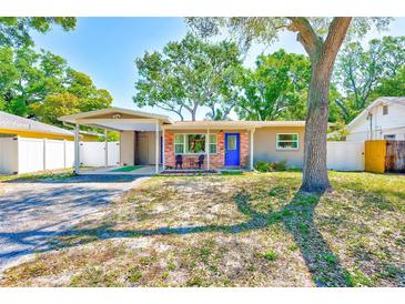 This well-maintained home boasts a cozy exterior and mature trees at 700 16Th Nw St, Largo, FL 33770