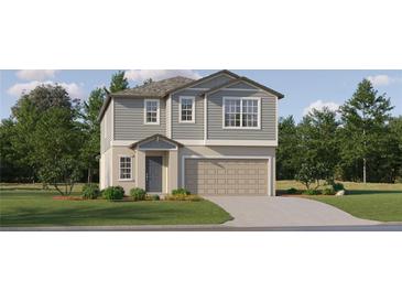 Charming two-story home with gray siding, landscaped yard, and a two-car garage at 9411 Raised Tulip Ln, Land O Lakes, FL 34637