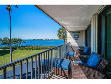 Relax on this inviting balcony with comfortable seating and breathtaking waterfront views at 2700 Bayshore Blvd # 9209, Dunedin, FL 34698