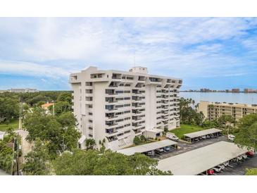 Elegant high-rise condo with multiple balconies, covered parking, and waterfront views on a sunny day at 30 Turner St # 502, Clearwater, FL 33756