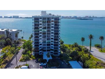 Stunning waterfront condominium building with bay views and lush tropical landscaping at 80 Rogers St # 2A, Clearwater, FL 33756