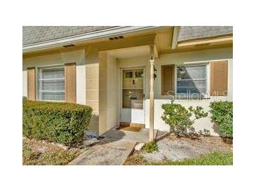 Charming condo with well-maintained landscaping and a welcoming entrance at 1421 Normandy Park Dr # 6, Clearwater, FL 33756