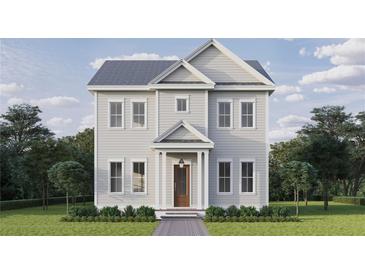 Charming two-story home with white siding, a gray roof, a well-manicured lawn and thoughtfully landscaped grounds at 621 37Th N Ave, St Petersburg, FL 33704