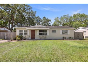 Charming single-story home featuring a well-maintained lawn and inviting front entrance at 6936 77Th N Ter, Pinellas Park, FL 33781