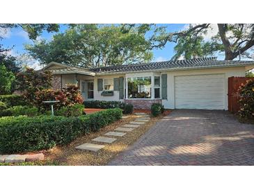Charming single-story home with well-manicured landscaping and brick-paved driveway at 5533 97Th N Way, St Petersburg, FL 33708
