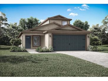 Charming single-Gathering home featuring a well-maintained lawn, covered entrance, and a two-car garage at 13180 Papercraft Ave, Brooksville, FL 34614