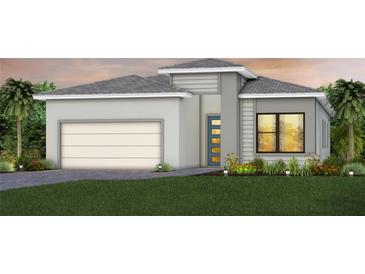 Charming single-Gathering home with a modern design, well-maintained lawn, and attached two-car garage at 4951 Ribbon Rock Cv, Lakewood Ranch, FL 34211