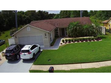 Lovely single-story home featuring a well-maintained lawn and inviting curb appeal at 7944 Royal Hart Dr, New Port Richey, FL 34653