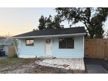 Charming home featuring a quaint entryway, simple design, and inviting facade at 1408 San Juan Ct, Clearwater, FL 33756