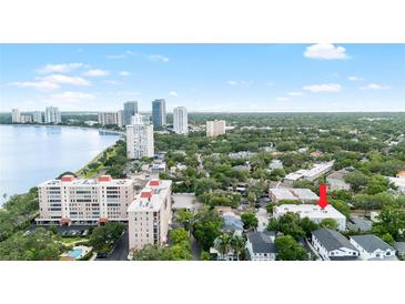 An aerial view shows a property nestled among mature trees and close to the waterfront at 2314 S Clewis Ct # 106, Tampa, FL 33629
