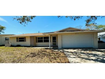 Charming single-story home with a well-maintained yard and attached two-car garage at 12054 145Th St, Largo, FL 33774
